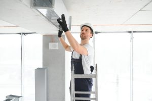 Hvac,Services,-,Worker,Install,Ducted,Pipe,System,For,Ventilation