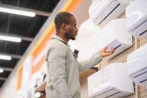 African,American,Man,Selecting,An,Air,Conditioner,In,An,Appliance
